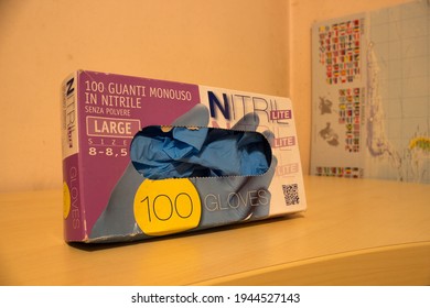 AVOLA, ITALY - Feb 02, 2021: Indoor Closeup Of A Box Of Nitrile Gloves, Single Use, Blue Color, Used To Protect Against Covid-19 Pandemic 