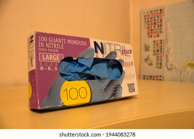 Avola, Sicily - March 21st 2021: Close Up Of A Box Of Blue Nitrile Gloves Used As An Additional Protection Against Coronavirus