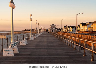 Avon By the Sea, New Jersey, USA - Golden hour sunrise on the boardwalk 