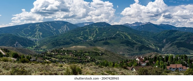 Avon, Colorado, USA - July 25, 2021: View Of Beaver Creek Ski Resort Of Vail Resorts During Summer Season. Cabins And Ski Runs In View With Sawatch Mountain Range In Background.