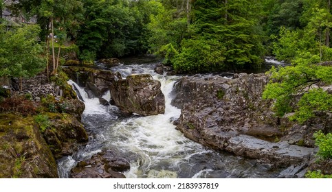 The Avon LLugwy Running Through Betws-y-Coed Village And Community In The Conwy Valley, North Wales UK
