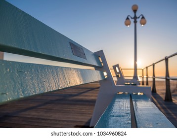 Avon-By-The-Sea Boardwalk. Blurred, Abstract Background Of Jersey Shore Boardwalk During Sunrise.    