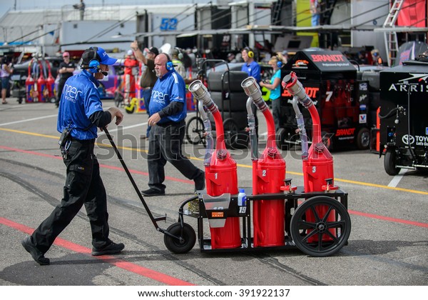 AVONDALE, AZ - MAR 11: mechanic hauling\
gasoline tanks at the NASCAR Xfinity Series Axalta 200 at Phoenix\
International Raceway in Avondale, AZ on March 11,\
2016