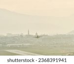 Avram Iancu airport runway in Cluj with plane taking off. East side view of Cluj Napoca, Romania. Passenger plane is taking off during a wonderful sunset.