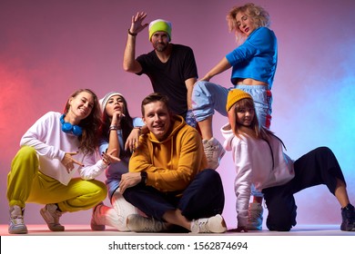 Avtive Break Dancers Showing Different Cheerful Emotions, Happy To Get First Place On Hip Hop Dance Competition, Sitting On Squats With Happy Faces, Energy And Fitness Concept