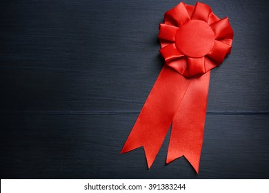 Award Ribbon On Wooden Background