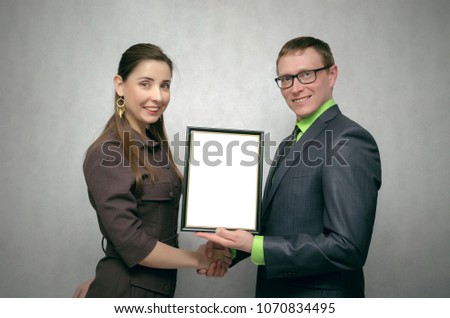 Awarding a diploma certificate to a best employee or student mock up. Winner award ceremony concept. One person handing a blank diploma with copy space to another person. Best worker or student.