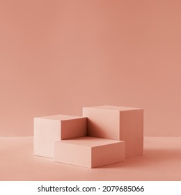 Awarding podium made of three 3d pastel square shapes of different sized against blank pink background for copy space - Shutterstock ID 2079685066