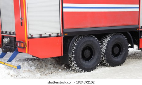 AWD 6x6 Fire Truck With Big Wheels Drives Off The Road Into A Snowdrift On Snow At Winter Day Closeup