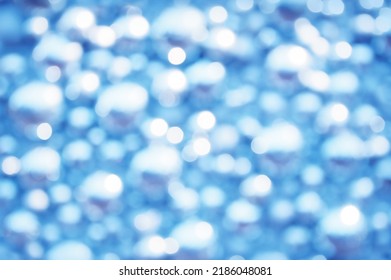 Awe beautiful christmaslight twinkly blue color dust glitz card copyspace area. Bright glittery de focus art soft sphere shape. Close-up view with space for text on dark cobalt merry xmas glowball sce