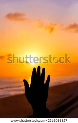 An awe-inspiring scene of a man in deep prayer, his figure sharply defined against the backdrop of the solstice sunset, evoking a sense of spirituality and divine connection to Jesus.