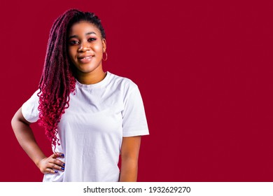 Awesome african woman with dreadlocks in studio wear white cotton t-shirt
