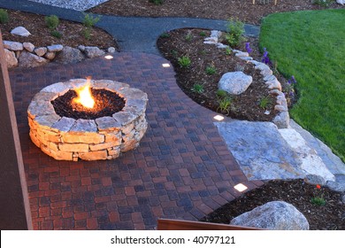 Awesome backyard with fire pit and illuminated paver patio