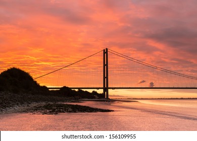 Awesome blood red, hellish sunrise over the Humber Bridge (UK)
