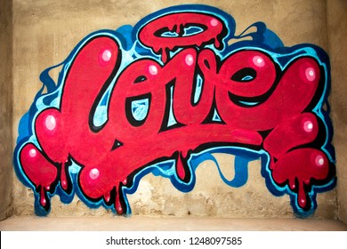 awesome graffiti of the word love sprayed on a wall 