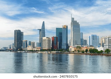 Awesome Ho Chi Minh City skyline. Amazing view of skyscrapers and other high-rise buildings reflected in water of the Saigon River at downtown of Ho Chi Minh City, Vietnam. Scenic cityscape. - Powered by Shutterstock