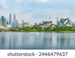 Awesome Kuala Lumpur skyline. Amazing view of scenic lake and fountains in a city park of Kuala Lumpur, Malaysia. Beautiful cityscape. Kuala Lumpur is a popular tourist destination of Asia.