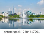 Awesome Kuala Lumpur skyline. Amazing view of scenic lake and fountains in a city park of Kuala Lumpur, Malaysia. Beautiful cityscape. Kuala Lumpur is a popular tourist destination of Asia.