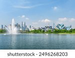 Awesome Kuala Lumpur skyline. Amazing view of scenic lake and fountains in a city park of Kuala Lumpur, Malaysia. Beautiful cityscape. Kuala Lumpur is a popular tourist destination of Asia.