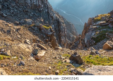 Awesome mountain view from cliff at very high altitude. Scenic landscape with beautiful sharp rocks near precipice and couloirs in sunlight. Beautiful mountain scenery on abyss edge with sharp stones. - Shutterstock ID 2204515141