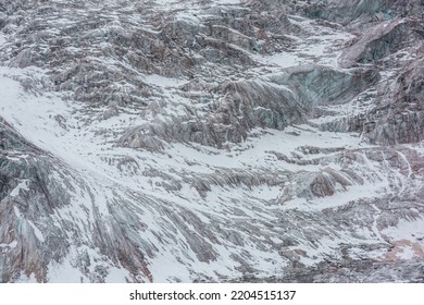 Awesome Nature Backdrop With Glacier Close-up. Beautiful Abstract Pattern Of Icefall. Natural Background With Mountain Glacier. Amazing Nature Of Mountains. Simple Texture. White Snow On Glacial Ice.