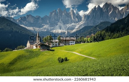 Awesome sunny Landscape. Dolomite Alps. Napure Background. Santa Maddalena village in front of the Geisler or Odle Dolomites Group, Val di Funes, Val di Funes, Trentino Alto Adige, Italy, Europe