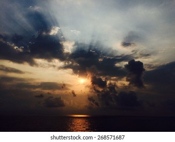 awesome sunset behind clouds.