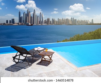 Awesome View Of The Dubai Marina From The Infinity Pool With A Deck Chair