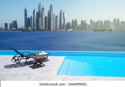 Awesome View Of The Dubai Marina From The Infinity Pool With A Deck Chair