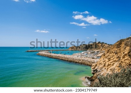 Awesome view of Marina in Albufeira, beautiful summer picture, blue sky and side walk, Fisherman Beach, Praia dos Pescadores, Albufeira, Portugal 