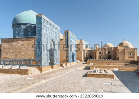 Awesome view of the Shah-i-Zinda Ensemble in Samarkand, Uzbekistan. Mausoleums decorated by blue tiles with designs. The necropolis is a popular tourist attraction of Central Asia.