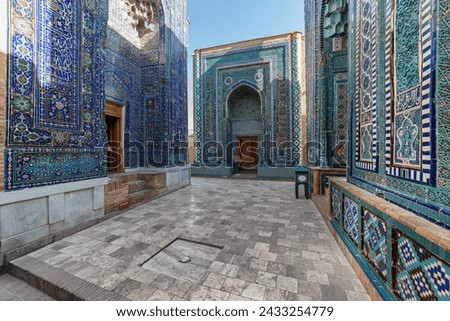 Awesome view of the upper group of mausoleums at the Shah-i-Zinda Ensemble in Samarkand, Uzbekistan. Mausoleums decorated by blue tiles with designs are a popular tourist attraction of Central Asia.
