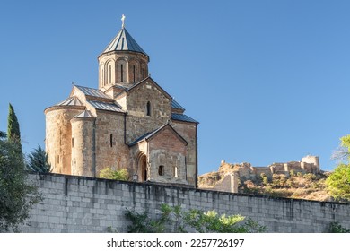 Awesome view of the Virgin Mary Assumption Church of Metekhi on the cliff over the Kura (Mtkvari) River in Tbilisi, Georgia. The Georgian Orthodox Christian church is a popular tourist attraction.