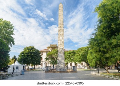 Awesome view of the Walled Obelisk (Constantine's Obelisk) in Sultanahmet Square of Istanbul, Turkey. Marmara University is visible in background. The roman monument is a popular tourist attraction.