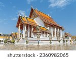 Awesome view of Wat Suthat Thepwararam in Bangkok, Thailand. Amazing exterior of the temple. The Buddhist temple is a landmark of Bangkok and a popular tourist attraction of Thailand.