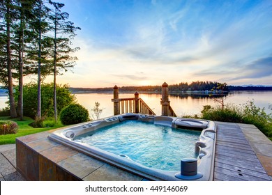 Awesome water view with hot tub in summer evening. House exterior. - Shutterstock ID 449146069