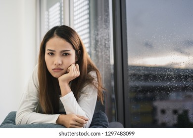 Awkward Couple, Issues In Family Concept. Sad Woman On Sofa Feeling Bad With Her Love Partner.