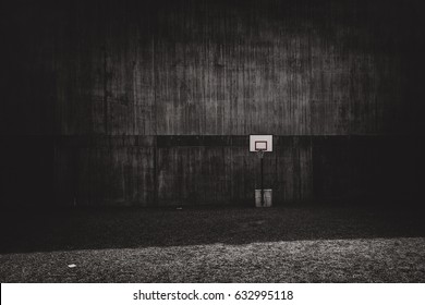Awkward placement of a basketball court on gravel and a bad placement of the hoop in general. Fineart