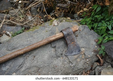 ax on the rock - Shutterstock ID 648133171
