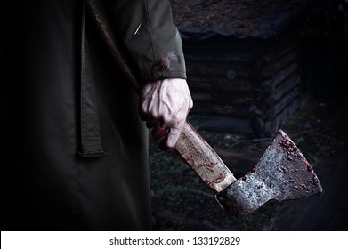 Axe With Blood In Male Hand.  Murderer Or Butcher, Halloween Theme