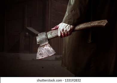 Axe With Blood In Male Hand.  Murderer Or Butcher, Halloween Theme