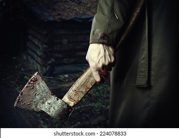 Axe With Blood In Male Hand.  Murderer Or Butcher, Halloween Theme