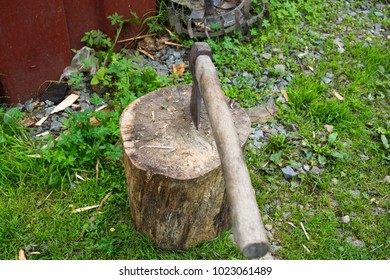 Axe in log. Close-up of axe handle.