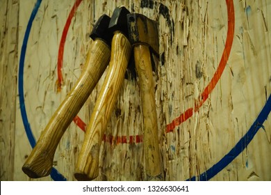Axe stick in to the wood bull's eye in throwing axe sport