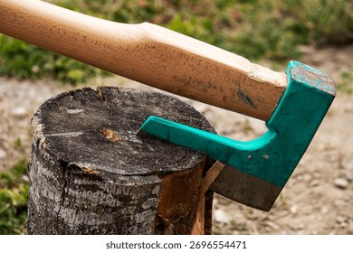 An axe stuck in a log, close up