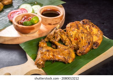 Ayam bakar or grilled chicken served with sambal or chilli sauce.