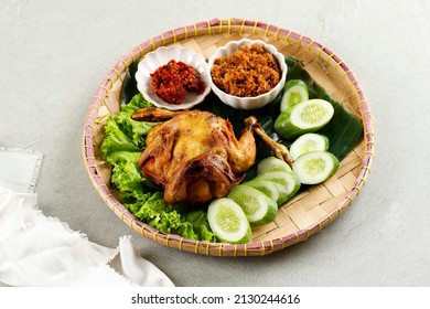 Ayam Ingkung Goreng or Bakakak Hayam, Deep Fried Whole Chicken, Indonesian Traditional Recipe, Usually Served with SAmbal and Vegetable