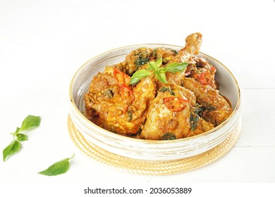 Ayam Woku, a typical chicken dish from Manado, North Sulawesi, Indonesia. Which has a rich aroma and a spicy taste. Isolated on white background.