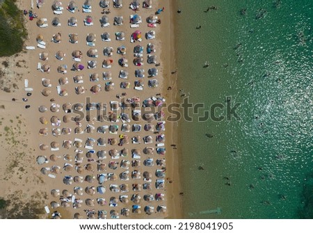 Similar – Aerial View From Flying Drone Of People Crowd Relaxing On Algarve Beach In Portugal