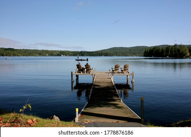 Ayer's Cliff, Canada - Summer 2015  A View Of Massawippi Lake And Of Physical Distancing On A Quay.